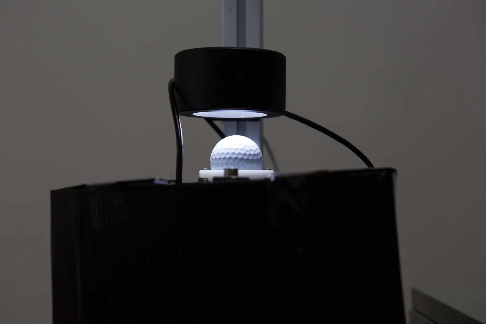Golf ball AOI inspection: a golf ball being imaged under a ring light